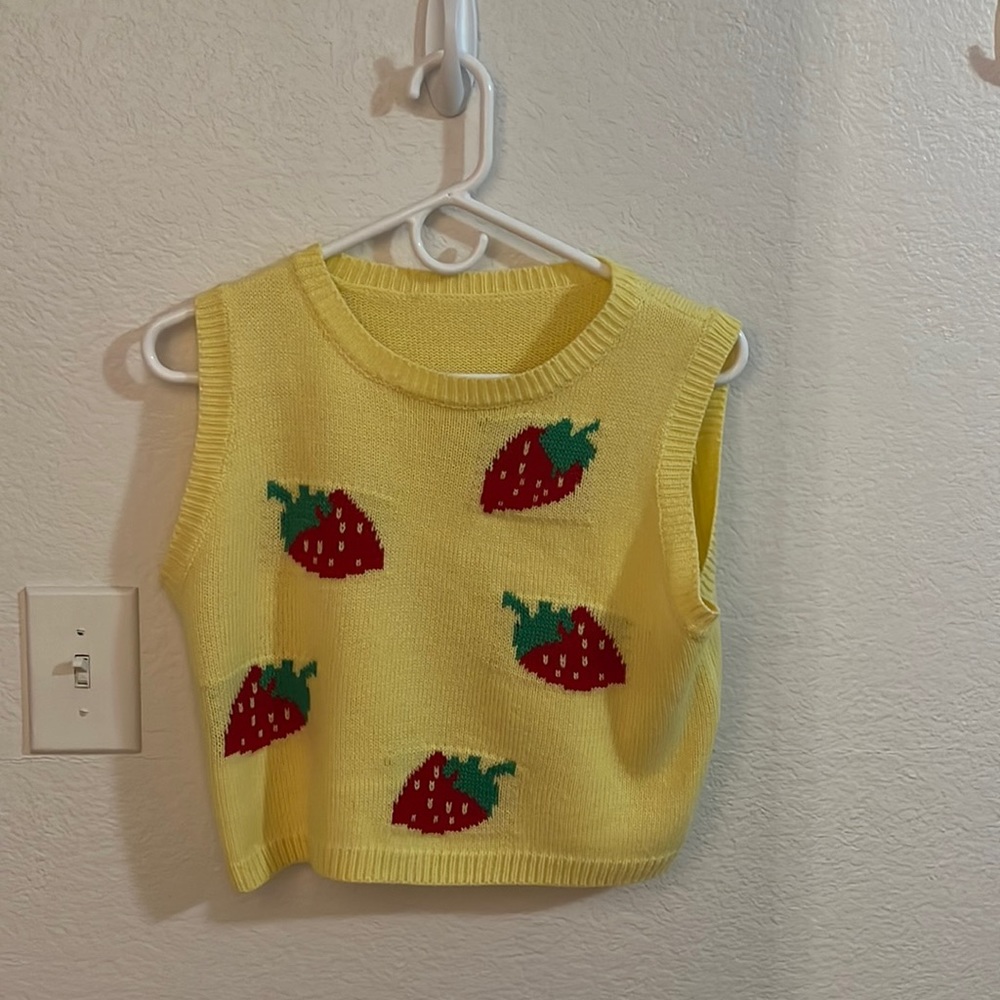 yellow sweater vest